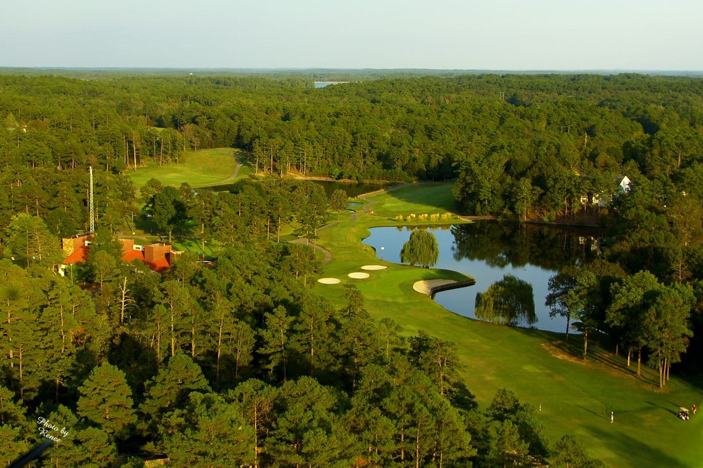 Hot Springs Village golf course clubhouse and pro shop beside a lake